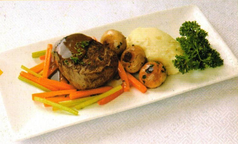 Pan-seared steak served with mashed potatoes and herb-infused mushrooms.